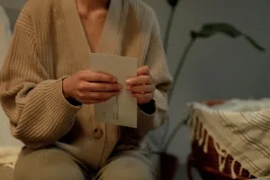 Business owner holding a formal bank letter of demand in an envelope