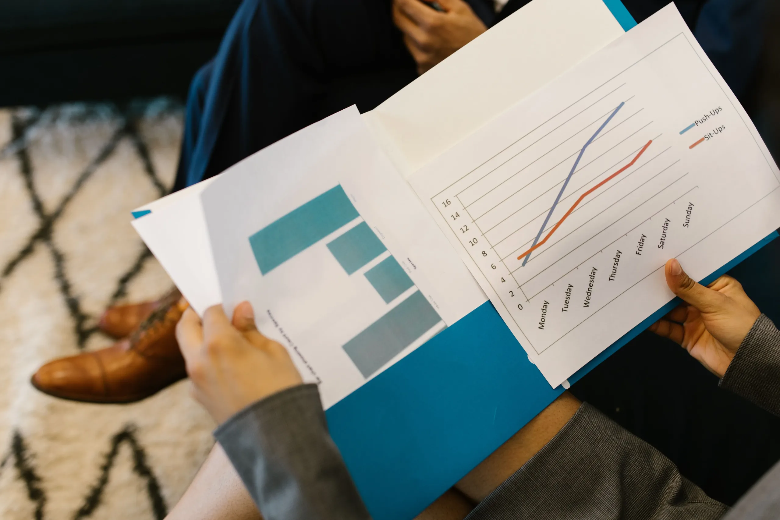 Business professionals reviewing company financial reports before a Creditors’ Voluntary Liquidation in Singapore