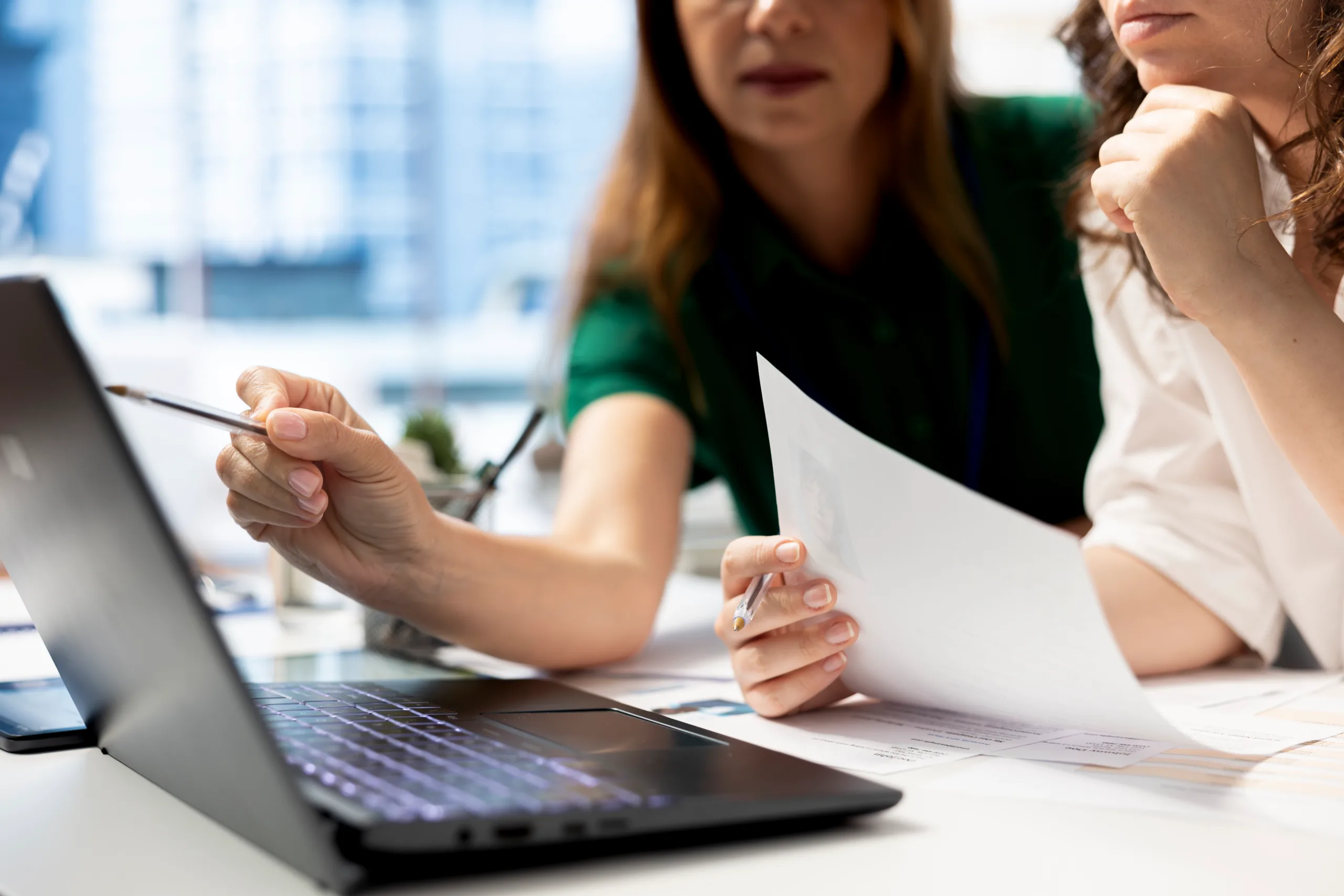 Individual reviewing financial documents during a bankruptcy consultation in Singapore